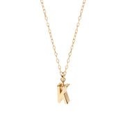 Minimalist gold letter K pendant necklace with a delicate anchor chain and secure clasp, perfect for layering or wearing solo.